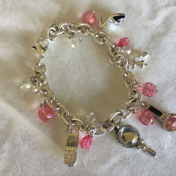 $12 ea of 3/$25. Silvertone “Girly” Charm Bracelet - Picture 4 of 7